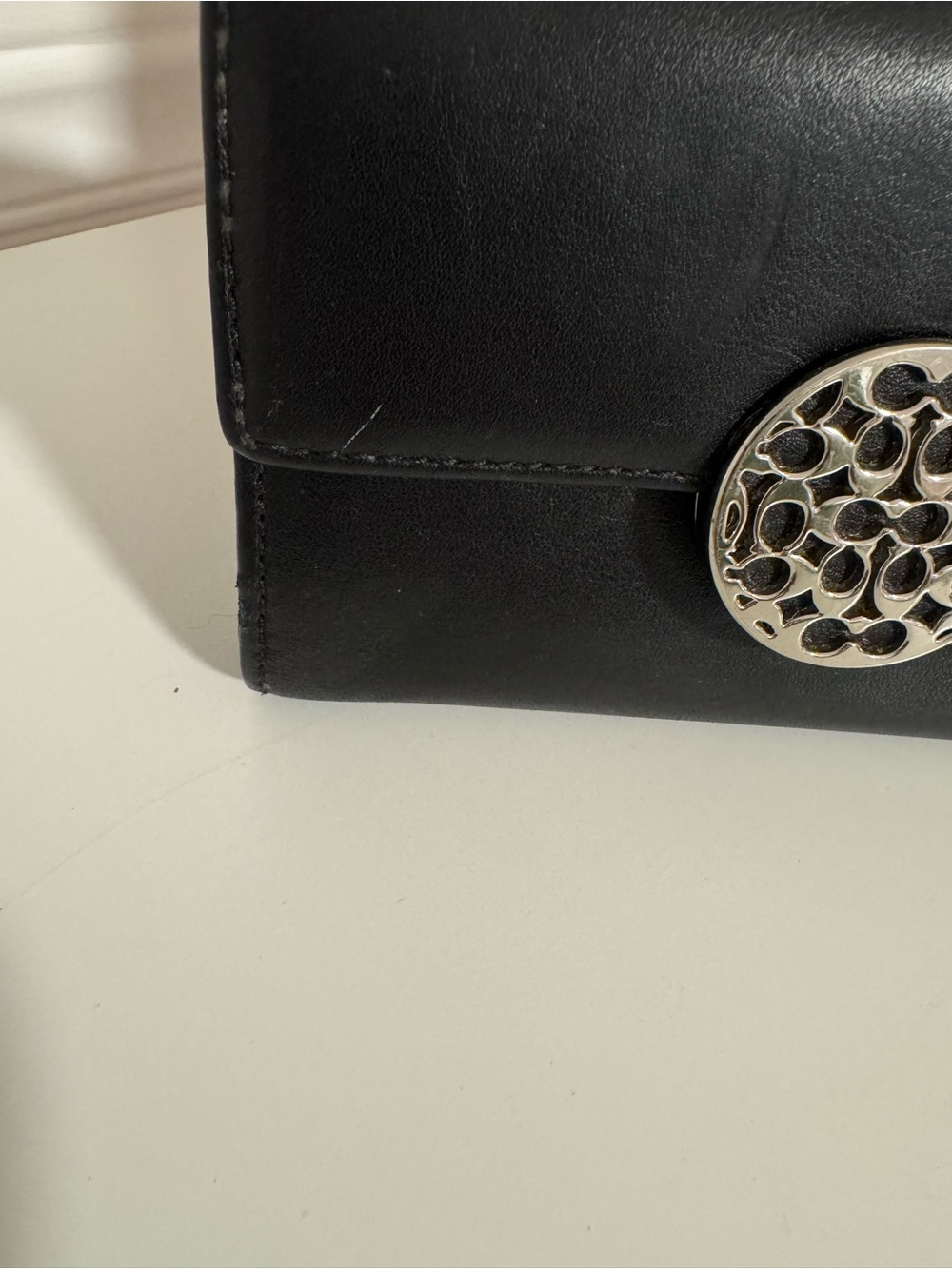 Classic Black Leather Wallet with Decorative Medallion - Picture 2 of 7